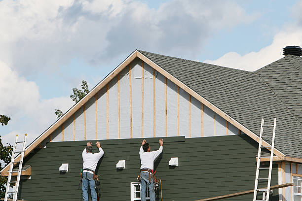 Professional Storm Damage Siding Repair technician working in Cortland, OH